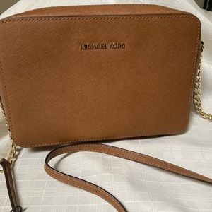 Michael Korrs crossbody Brown  purse.